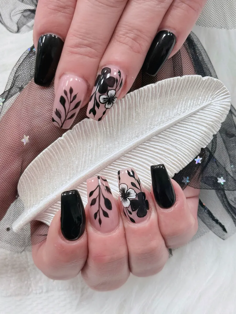 Black and nude nails with fine leaf artwork by V Nails Lacombe