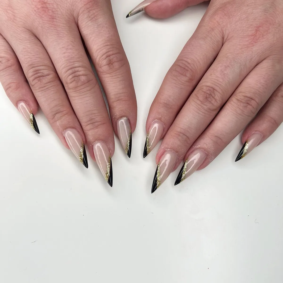 Silver mirror chrome stiletto nails by V Nails Lacombe