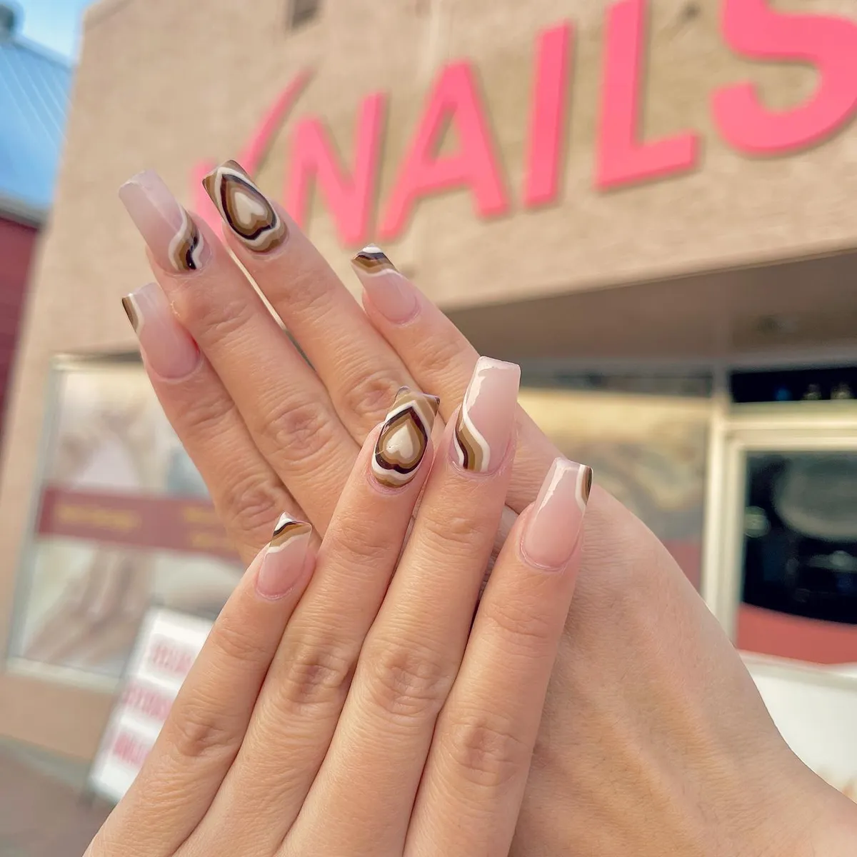 Nude almond nails with raised metallic gold swirls by V Nails Lacombe