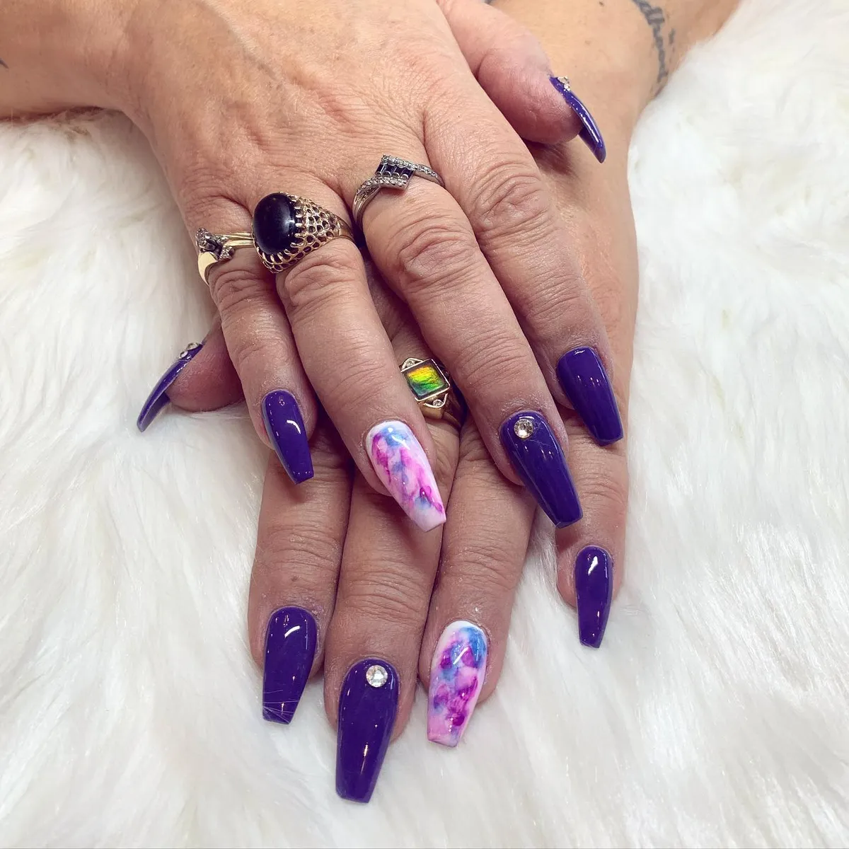 Long purple nails with pink floral marble accent art by V Nails Lacombe