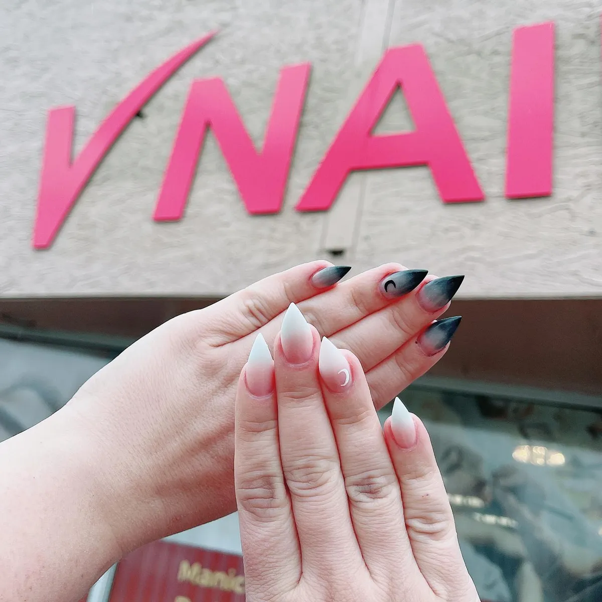 Long red, black and white angled French nails by V Nails Lacombe