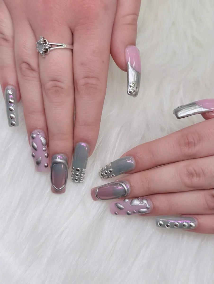 Silver chrome nails with dimensional rhinestone details by V Nails Lacombe