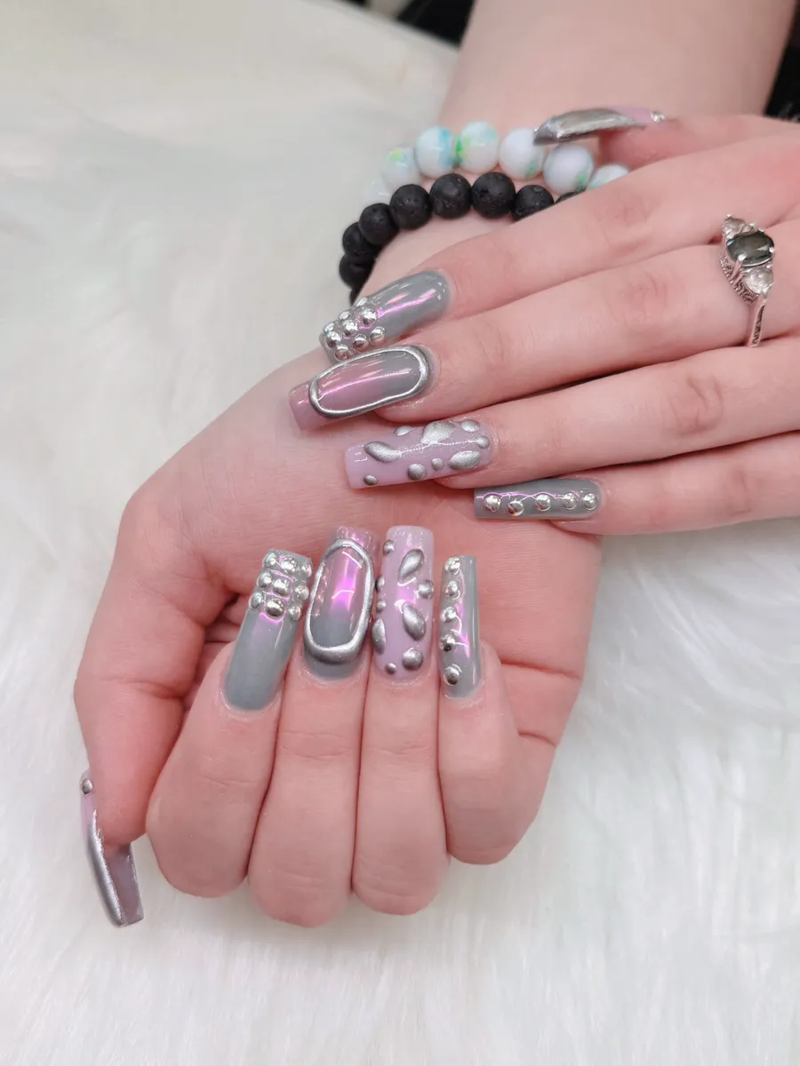 Silver chrome nails with raised textured accents by V Nails Lacombe